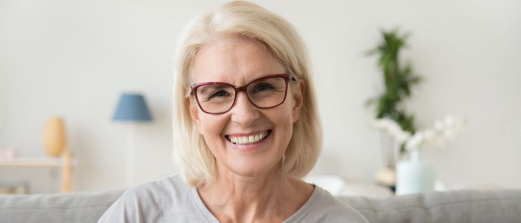 Smiling Middle Aged Mature Grey Haired Woman Looking At Camera