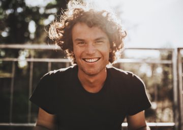 Outdoor Closeup Portrait Of Handsome Freckled Smiling Male With