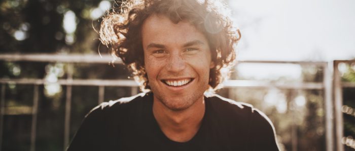 Outdoor Closeup Portrait Of Handsome Freckled Smiling Male With